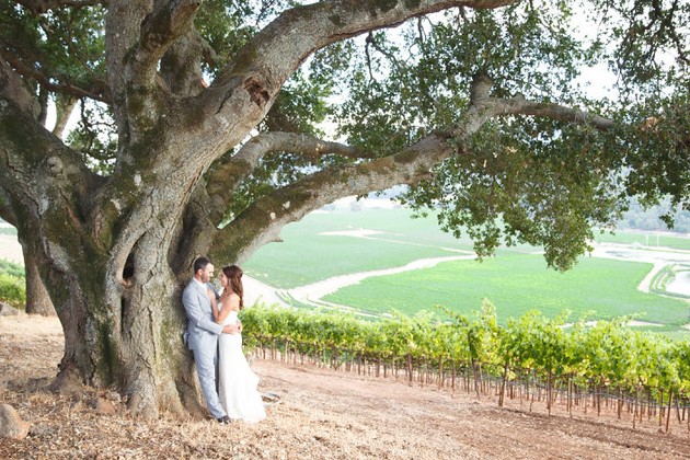 Boot Hill: Couple embracing beneath a tree.